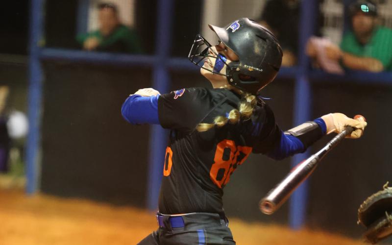 Branford catcher Morgan Brennan watches a hit ball against Suwannee on March 5. (PAUL BUCHANAN/Special to the Reporter)