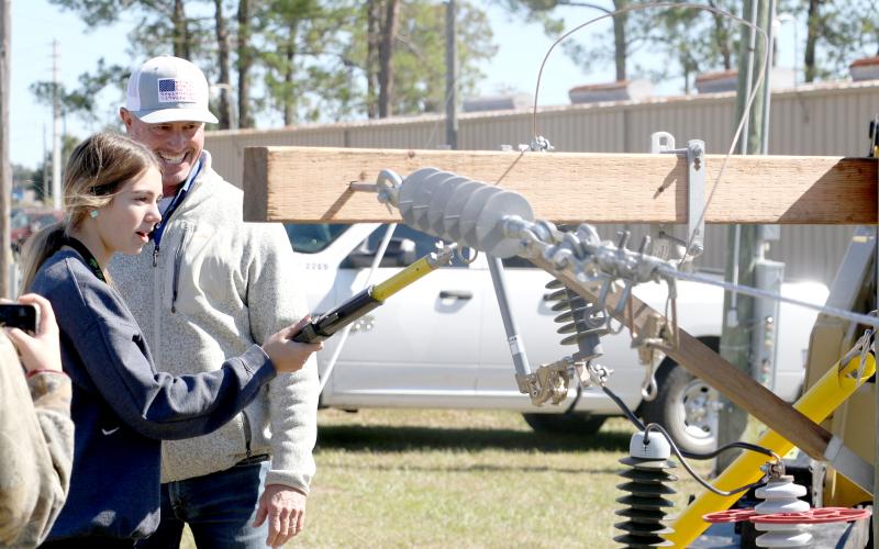 An area high school student tries her hand on working with electric lines at the Clay Electric Cooperative booth at the 2022 Build My Future event. This year’s event is Wednesday at the Florida Gateway Fairgrounds. (FILE)