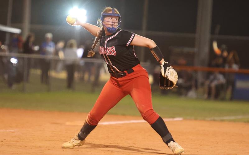Fort White's Hannah LeBleu throws to first base during a game against Branford on March 1. (PAUL BUCHANAN/Special to the Reporter)