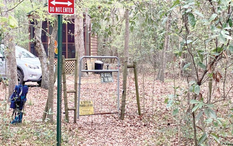 A gate into Rum Island Park from a neighboring property that stands in place of a county fence, which Columbia County officials say was cut to provide free access into the park. (COURTESY)