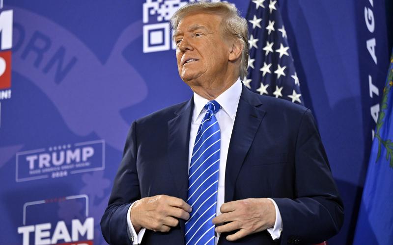 Republican presidential candidate and former U.S. President Donald Trump stands on stage during a campaign event at Big League Dreams Las Vegas on Jan. 27. (DAVID BECKER/Getty Images/TNS)
