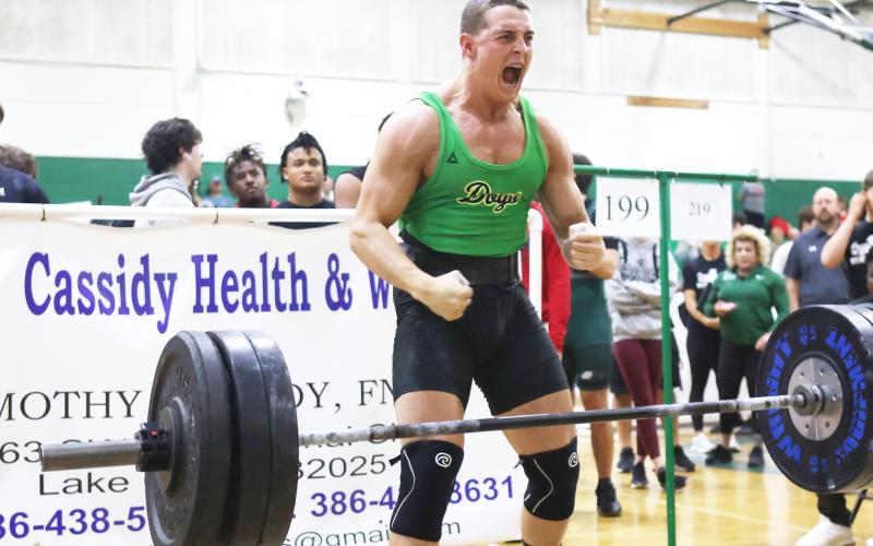 Suwannee’s Sam Wainwright celebrates after completing his clean and jerk during he Bulldog Invitational on Friday. (PAUL BUCHANAN/Special to the Reporter)