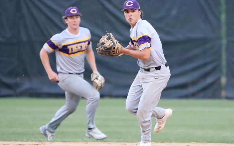 Columbia second baseman Grant Bowers turns to make a throw to first base against Buchholz on Tuesday. (BRENT KUYKENDALL/Lake City Reporter)