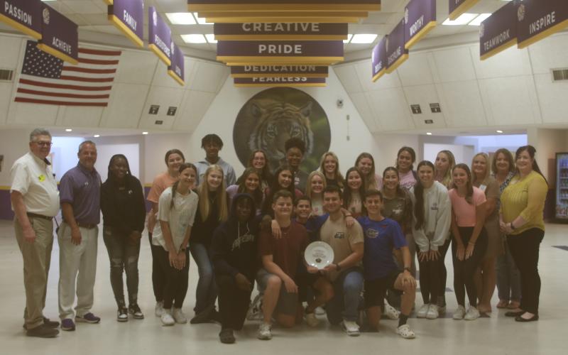 Columbia High School students received the ‘Dinner Plate Award’ on Monday from Catholic Charities and Florida Gateway Food Bank officials. CHS won the award for collecting the most food last fall during the Thanksgiving food drive. (JAMIE WACHTER/Lake City Reporter)