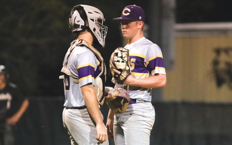 Columbia catcher Casen Maddox walks out to the pitcher’s mound to talk to pitcher Trayce McKenzie on Tuesday. (BRENT KUYKENDALL/Lake City Reporter)