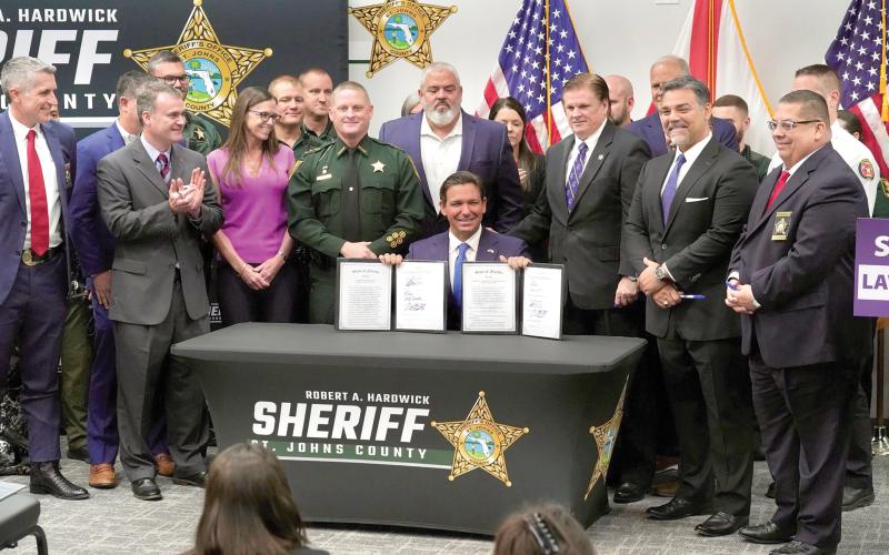Gov. Ron DeSantis signed a pair of bills Friday, including one that would limit the scope of police review boards, during a ceremony at the St. Johns County Sheriff’s Office in St. Augustine. (COURTESY)