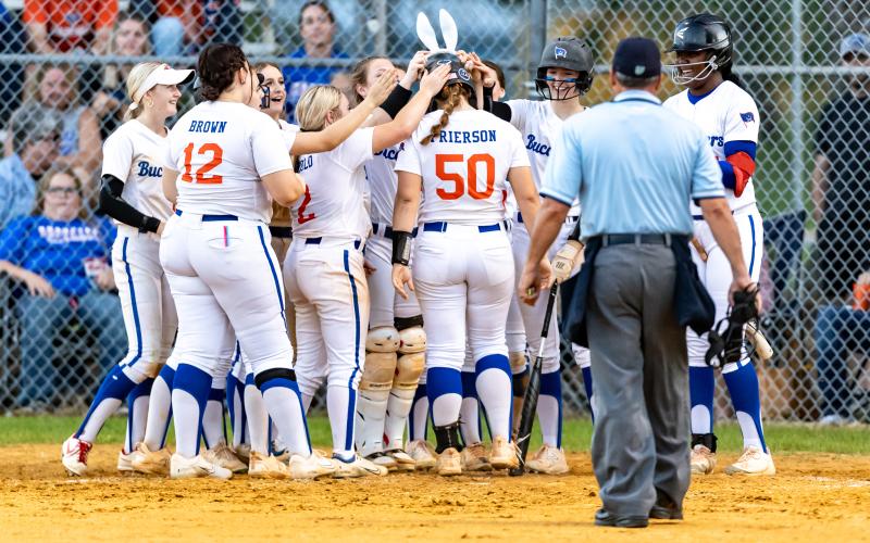 The Branford softball team greets center fielder Ellie Frierson (50) at home plate after she hit a home run against Lafayette on Friday. (JACK HOWDESHELL/Special to the Reporter)