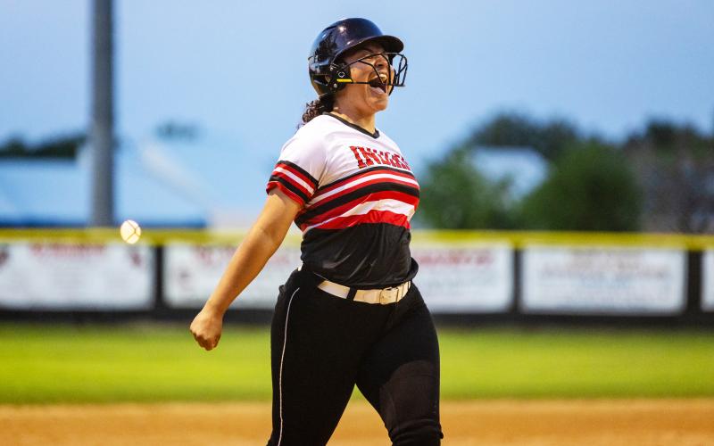 Fort White’s Meloney Heagles celebrates as she runs to home plate after hitting a 2-run home run during a 7-run fifth inning in Tuesday’s 13-0 win over Lafayette. (JACK HOWDESHELL/Special to the Reporter)