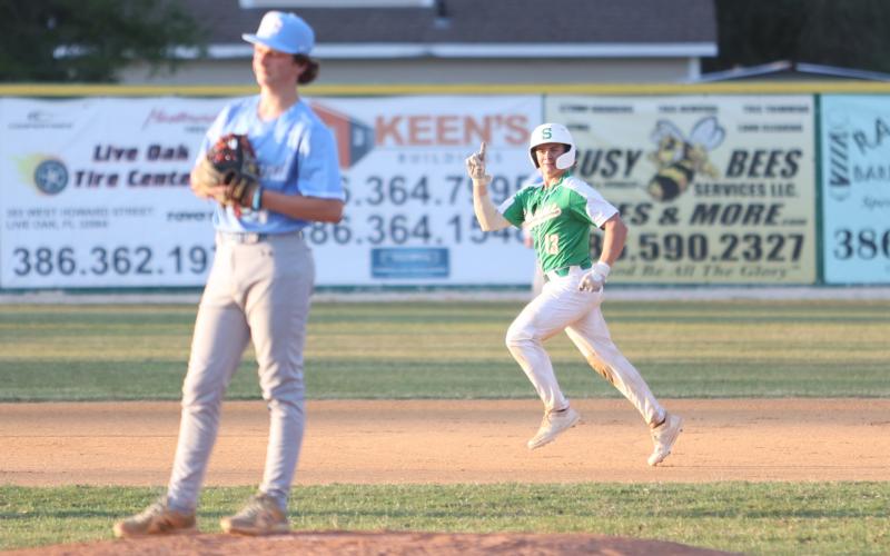 Suwannee’s Grayson Bonds celebrates heading to third base after hitting a home run against Chiefland on Friday. (PAUL BUCHANAN/Special to the Reporter)