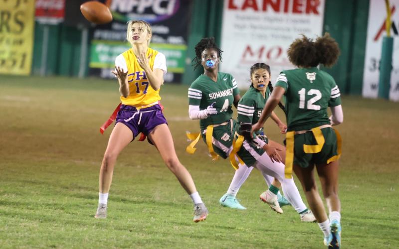 Columbia receiver Mia Brasel makes a catch against Suwannee on March 12. (PAUL BUCHANAN/Special to the Reporter)
