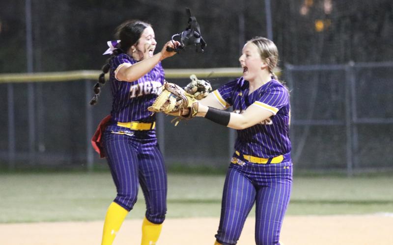Columbia pitcher Kinley King (left) celebrates with first baseman Kimber Long after defeating Oakleaf 5-4 on Thursday. (JORDAN KROEGER/Lake City Reporter)