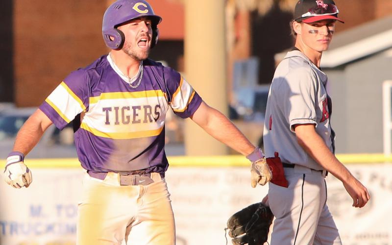 Columbia catcher Casen Maddox celebrates at second base next to Bishop Kenny second baseman Troy Ancayan after hitting a go-ahead 2-RBI double in the sixth inning of Friday’s 8-7 win. (BRENT KUYKENDALL/Lake City Reporter)