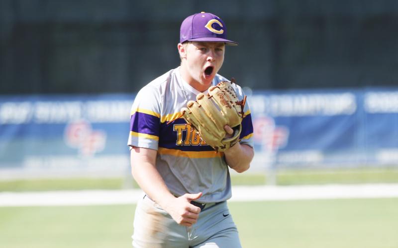 Columbia pitcher Trayce McKenzie celebrates walking off the mound after striking out the side in the third inning of Tuesday’s game against The Villages Charter. (JORDAN KROEGER/Lake City Reporter)