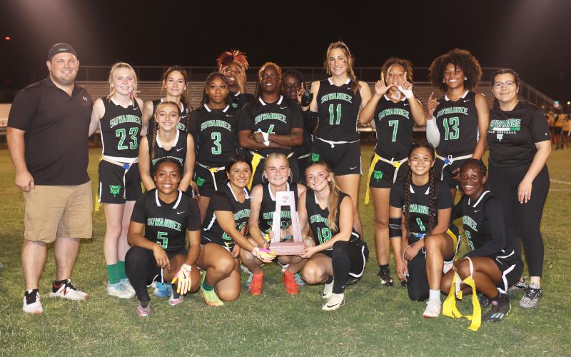 Suwannee’s flag football team poses with the District 3-1A championship trophy after defeating Columbia 6-0 on Wednesday. (PAUL BUCHANAN/Special to the Reporter)