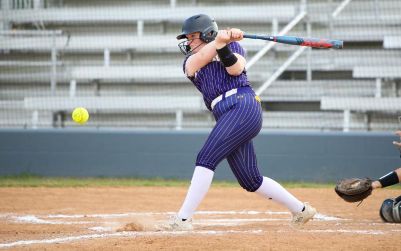 Columbia catcher RaeLyn Wehinger hits a 2-RBI double against Riverside on Wednesday. (BRENT KUYKENDALL/Lake City Reporter)