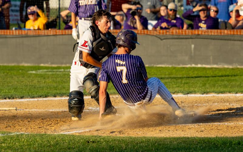 Lafayette catcher Brayden Richardson tags out Union County runner Foster Smith at home plate to end the top of the second inning during Saturday's Region 3-1A championship. (JACK HOWDESHELL/Special to the Reporter)