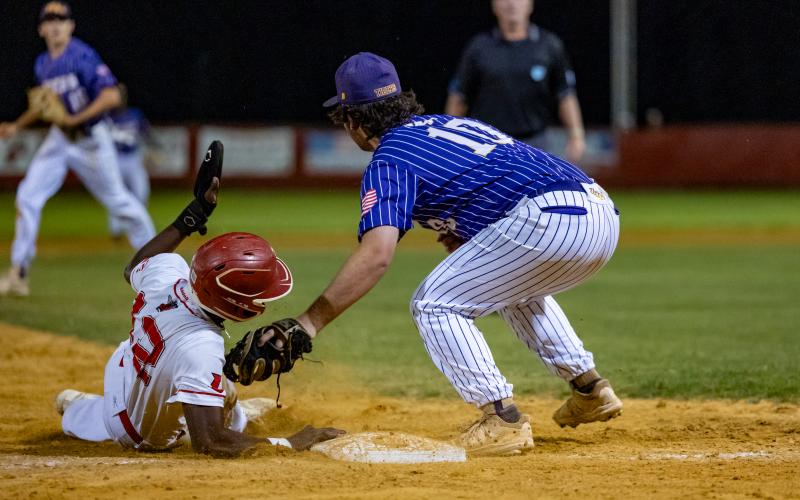 Lafayette outfielder Tywan Williamson slides safely into third base past the tag of Union County's Jake Walker during Saturday's Region 3-1A championship. (JACK HOWDESHELL/Special to the Reporter)