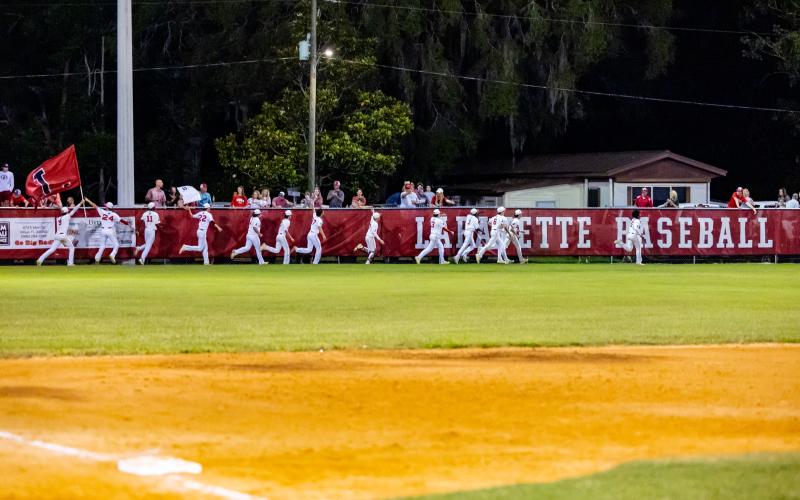 Lafayette players celebrate with fans after defeating Union County 4-0 to win the Region 3-1A championship on Saturday. (JACK HOWDESHELL/Special to the Reporter)