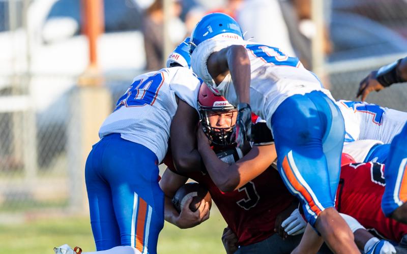 Lafayette running back Dayne McCray is tackled by a group of Taylor County defenders during Thursday's spring game. (JACK HOWDESHELL/Special to the Reporter)