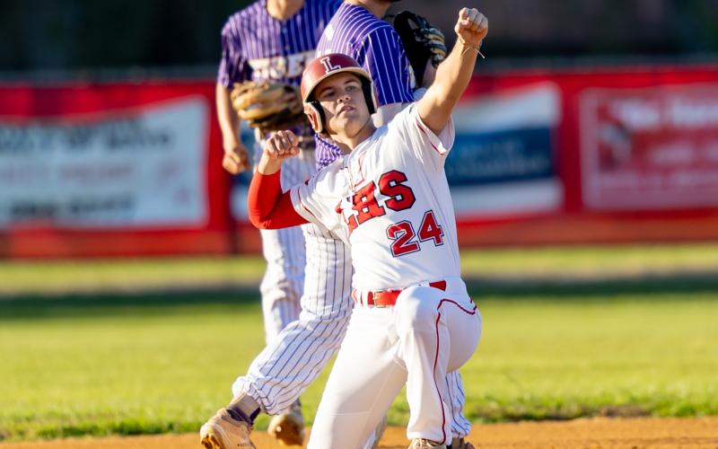 Lafayette second baseman Hyatt Richardson celebrates at second base after hitting a double against Union County during Saturday's Region 3-1A championship. (JACK HOWDESHELL/Special to the Reporter)