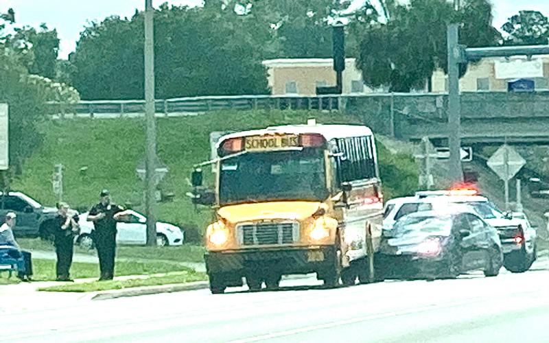 A Columbia County school bus sits on U.S. Highway 90 after it was rear-ended by a car Wednesday afternoon. No students were on board the bus at the time. (TODD WILSON/Lake City Reporter)