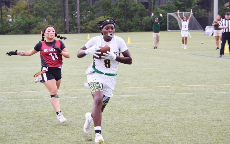 FGC receiver Alexandra Harris runs past Hesston College’s Destiny Ortiz for a touchdown during Game 1 of the NJCAA National Championship series on Wednesday. (COURTESY OF FGC)