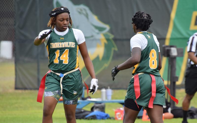 FGC's Makayla Brown (14) celebrates with Alexandra Harris (8) during their team's win over Florida State on March 2. (COURTESY OF FGC)