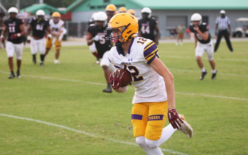 Cade Frier runs up the field after a catch during Columbia’s spring game against Fort White on May 17. (JORDAN KROEGER/Lake City Reporter)