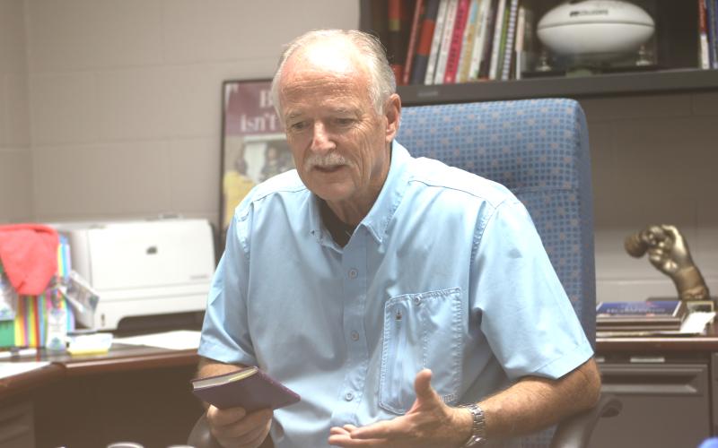 Branford High Principal Terry Huddleston recounts his 45-year education career Wednesday. Huddleston is retiring this summer after seven years at Branford. Huddleston previously worked in the Columbia County School District including serving as superintendent from 2012-16. (JAMIE WACHTER/Lake City Reporter)