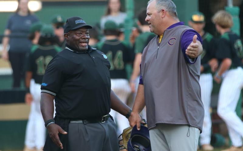 Columbia coach Chris Howard argues a call with the home plate umpire during Thursday's District 2-5A championship against Lincoln. (JORDAN KROEGER/Lake City Reporter)