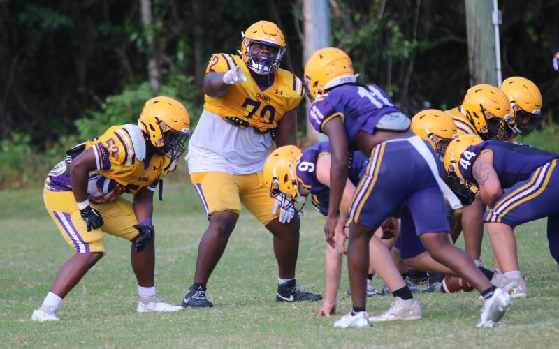Columbia offensive lineman Chase Johnson calls out a defender during Monday's practice. (JORDAN KROEGER/Lake City Reporter)