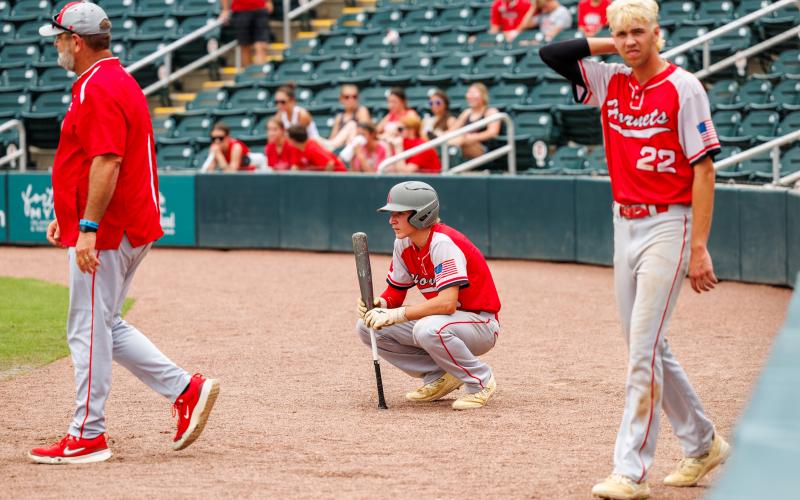 Lafayette shortstop Trevor Byrd (left) sits behind home plate alongside first baseman Noah Lamb after the Hornets fell to Jay 4-2 in the Class 1A state semifinals on Wednesday at Hammond Stadium in Fort Myers. (JACK HOWDESHELL/Special to the Reporter)