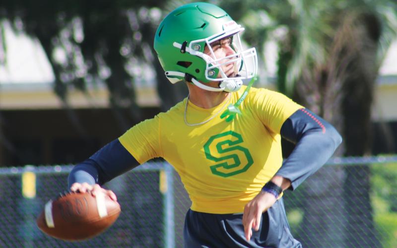 Suwannee quarterback Thomas Sikes drops back to pass during practice on April 29. (JAMIE WACHTER/Lake City Reporter)
