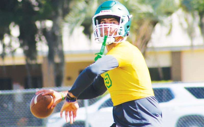 Suwannee quarterback Thomas Sikes drops back to pass during Monday’s practice. (JAMIE WACHER/Lake City Reporter)