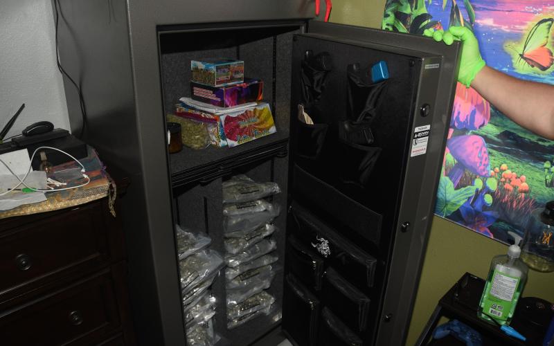 During a drug bust Friday at a Koonville Avenue residence, drugs were found in a gun safe in one of the bedrooms, as well as in the kitchen cabinets and on the porch. (COURTESY)
