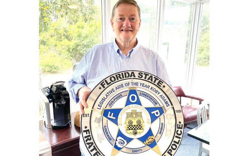Lake City’s Koby Adams, a legislative assistant to Dist. 12 State Rep. Wyman Duggan of Jacksonville, was honored as 2024 Legislative Aide of the Year by the Florida State Fraternal Order of Police during the group’s annual convention this week in Orlando. (TODD WILSON/Lake City Reporter)