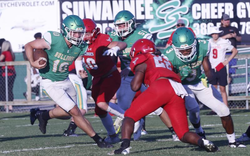 Suwannee’s Koy Frier scrambles up the field while playing quarterback during his team’s spring jamboree against Bradford on May 17. Frier split time at quarterback with Thomas Sikes during the spring but will now be used as an ‘athlete’ this summer. (JAMIE WACHTER/Lake City Reporter)