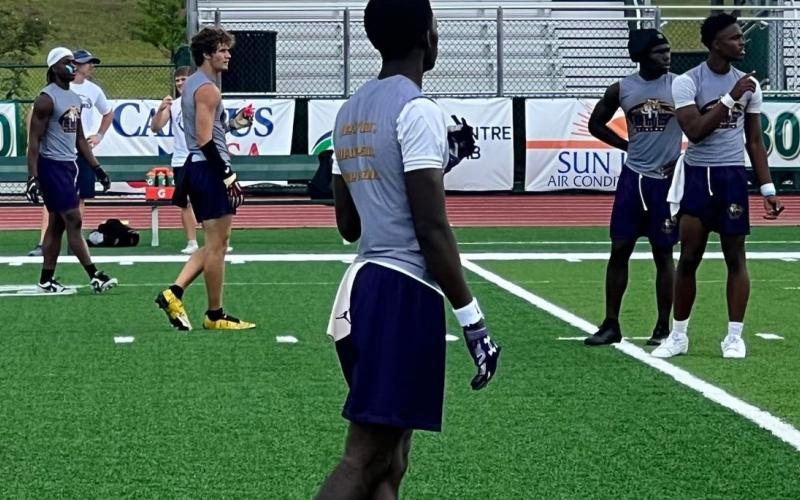 Columbia's offense receives a play call during the FHS 7v7 Tournament that took place Friday and Saturday. (COURTESY)