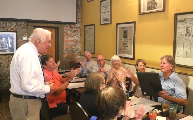 Mayor Stephen Witt delivers a speech during Keith Williams’ retirement party Thursday at Marion Street Bistro. Witt also provided Williams with a proclamation celebrating his years of service. (MORGAN MCMULLEN/Lake City Reporter)