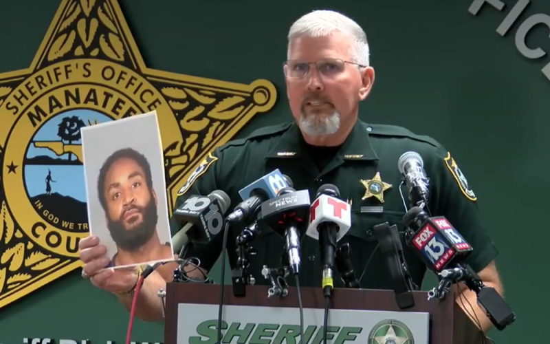 Manatee County Sheriff Rick Wells holds up a photo of Javontee Brice, who shot and killed three people in Manatee County, before being shot and killed after shooting at Hamilton County deputies early Tuesday morning. (COURTESY)