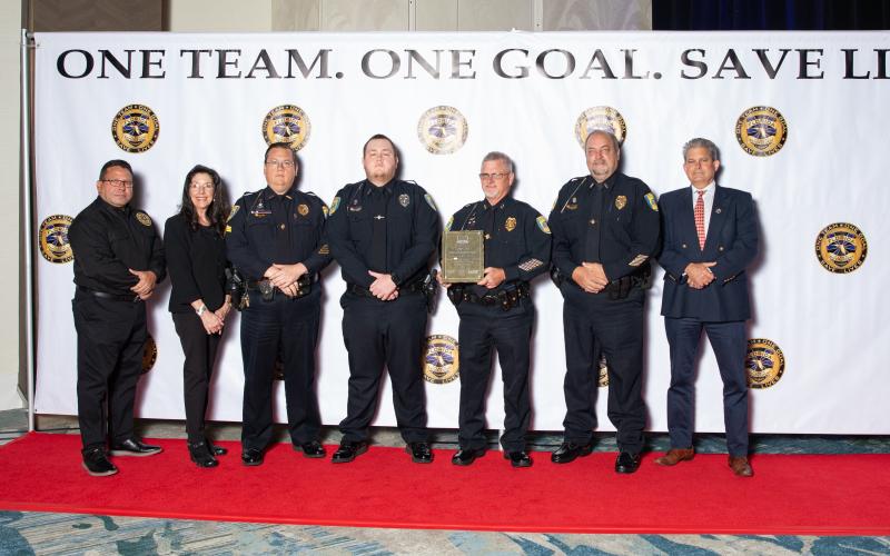 The Lake City Police Department received the top traffic safety award at last week’s Traffic Safety Challenge Awards ceremony. Accepting the award for the LCPD were Sgt. Mike Lee (third from left), Traffic Officer Blake Craig, Assistant Chief Andy Miles and Lt. Robert Milligan. (COURTESY LAKE CITY POLICE DEPARTMENT)