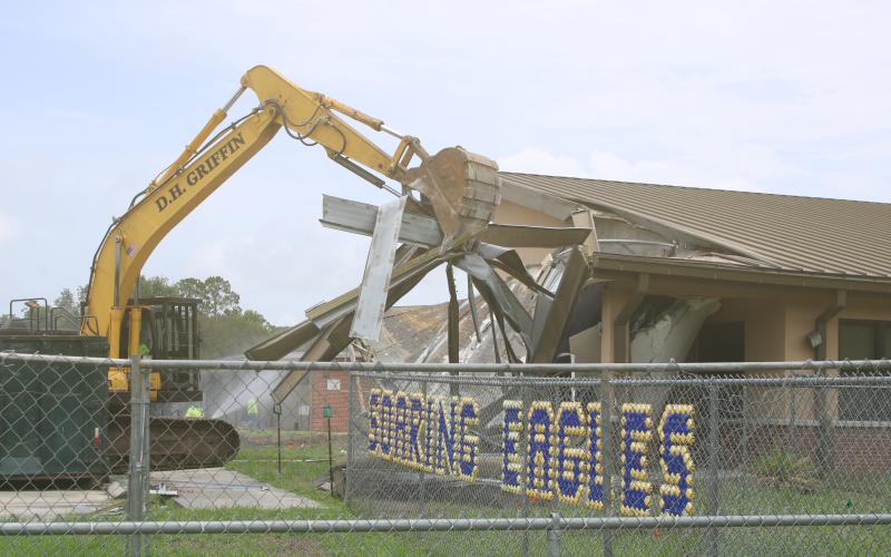 Crews began knocking down the office area at Niblack Elementary School on Wednesday as demolition is underway to create room for a new school on the site. (TONY BRITT/Lake City Reporter)