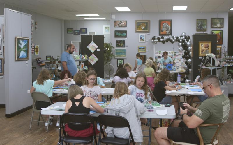Area youngsters and some of their parents take part in the Young daVinci Summer Art Camp at the Gateway Art Gallery. This year’s camp was funded through a grant from Clay Electric and had 20 children attend the three-day camp. (TONY BRITT/Lake City Reporter)