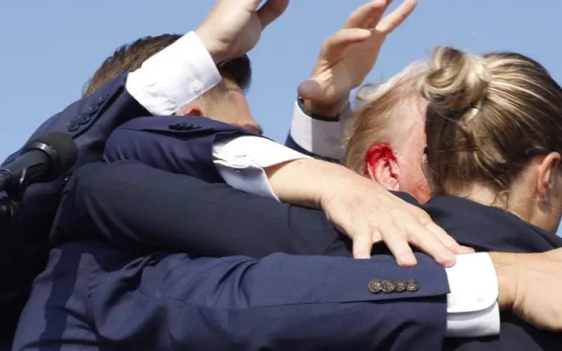 Republican presidential candidate former President Donald Trump is rushed offstage during a rally on Saturday in Butler, Pennsylvania. (ANNA MONEYMAKER/Getty Images)