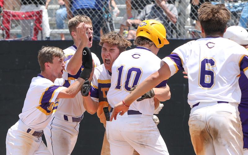 Columbia’s Ayden Phillips hugs Josh Fernald (10) at home plate after Fernald hit a walk-off grand slam against Lincoln in the Region 1-5A semifinals on May 12, 2023. (FILE)