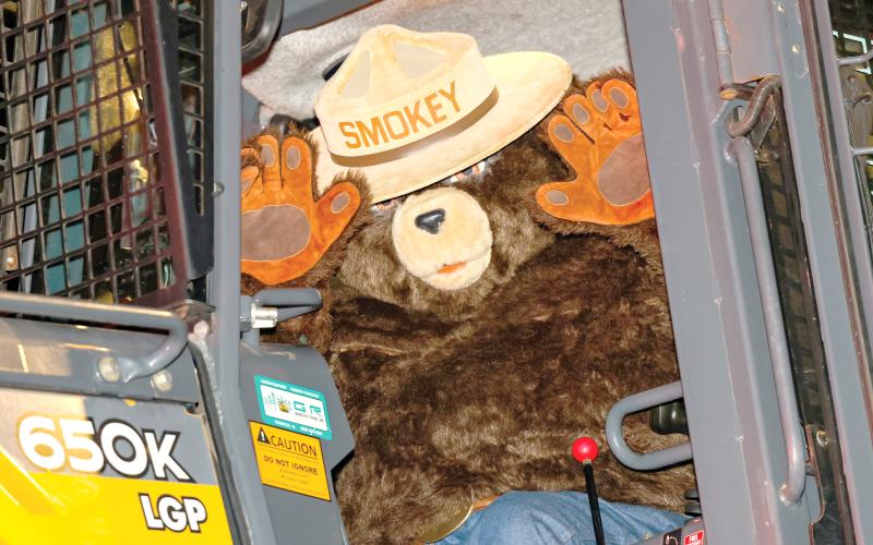 Smokey Bear, waving during the Lafayette County Christmas parade last winter, will be celebrating his 80th birthday at Alligator Lake Park on Saturday. (JACK HOWDESHELL/Special to the Reporter)