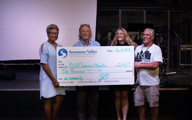 Kecia Robinson with the Suwannee Valley Community Foundation (from left) provides a check for $2,000 to Uplift Suwannee and Hamilton counties to Dusty Pye with LSF Health Systems, Chrissy Polovich with Mountain2Sea Ministries and Greg Player with Recovery Church. (COURTESY)