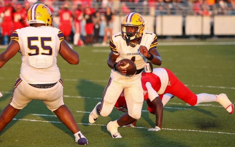 Columbia quarterback Zamarion Jones escapes a sack and scrambles up the field against Bradford during Friday’s Preseason Classic. (BRENT KUYKENDALL/Lake City Reporter)