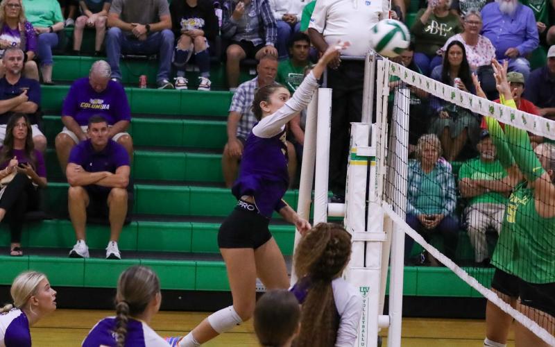 Columbia hitter Sinei Wood fires a shot over the net against Suwannee on Aug. 20. (BRENT KUYKENDALL/Lake City Reporter)
