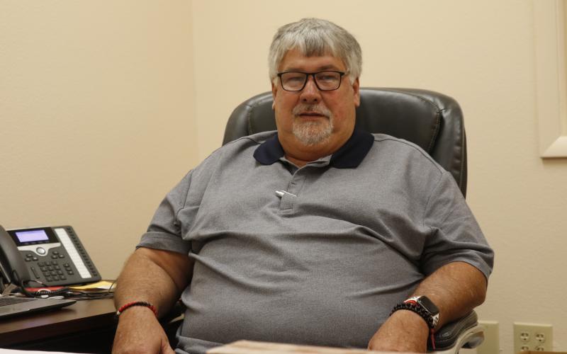 Keith Couey, pictured sitting in his office at the Columbia County School District administration building as he transitions into becoming the district’s superintendent in November, aims to remain visible at school sites. (JAMIE WACHTER/Lake City Reporter)